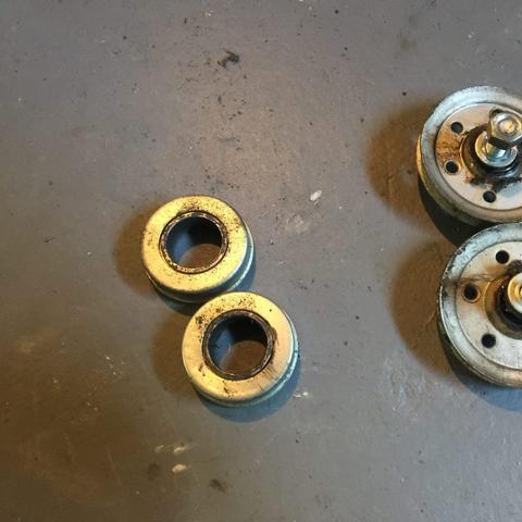 Old bearing and pulley for rear mount type garage door