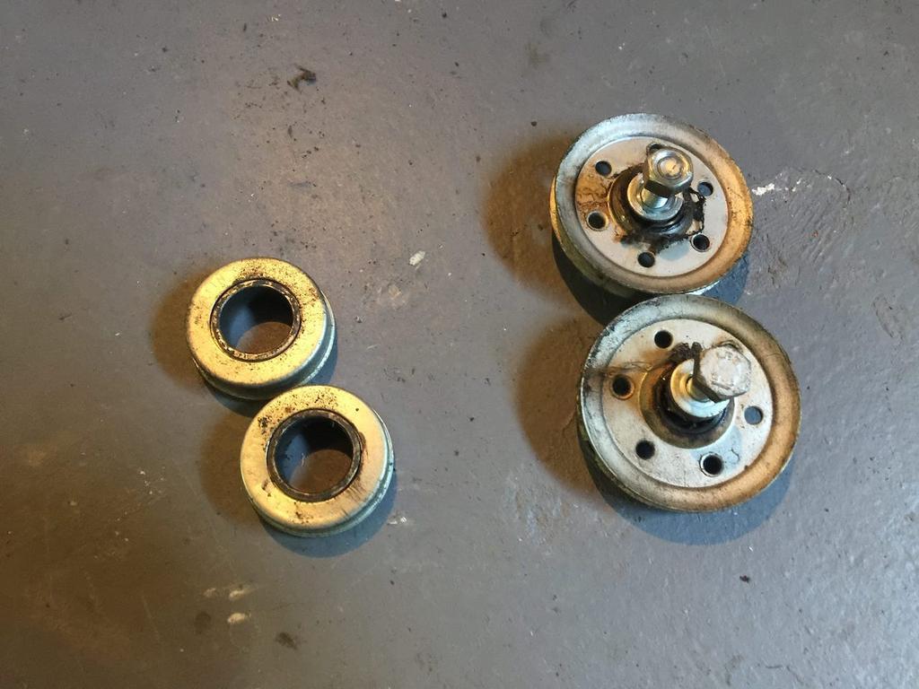 Old bearing and pulley for rear mount type garage door